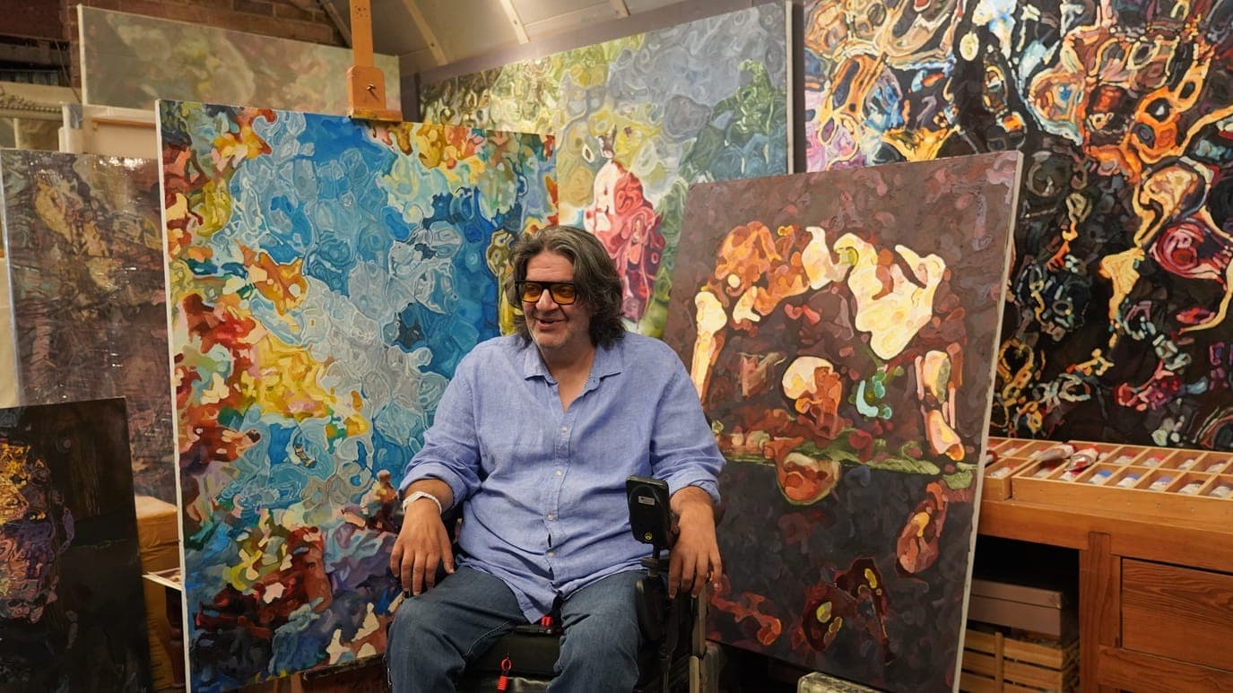 Afshin Naghouni in his studio, surrounded by canvases from Reveries in Fracture