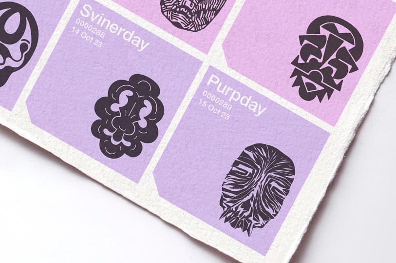 A corner of the Delehag Calendar printed on deckle-edged paper, pink and lilac tiles each carrying a black icon and a unique day name — Svinerday, Purpday — above a running serial number and date